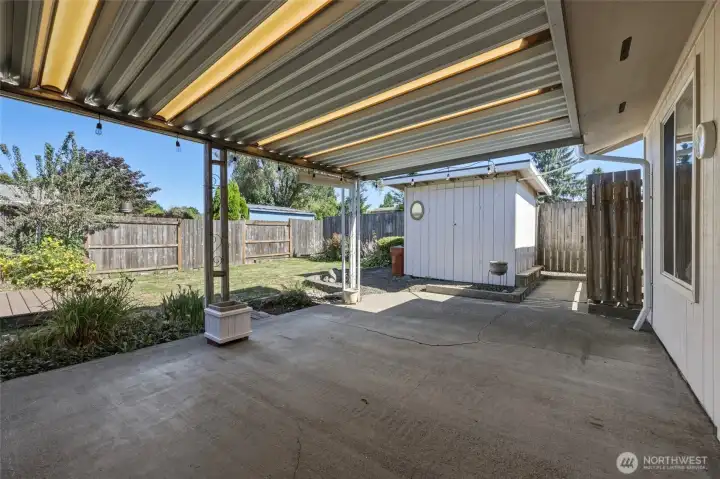 Large covered patio with plenty of room for outdoor dining and entertaining.