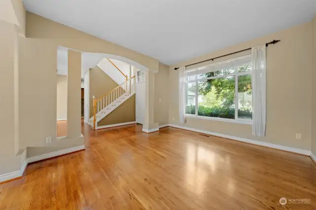 Formal living room with large window making this room light and bright.