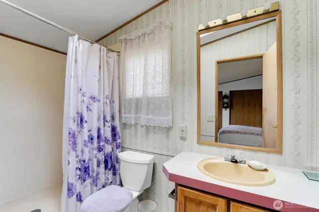 Primary 3/4 Bath with Walk-In Closet.