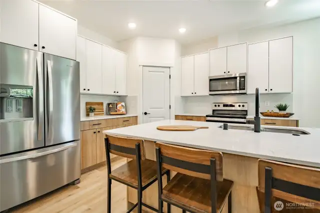 Photos shown are of a similar floor plan previously built in a different neighborhood (The Ridge in Blaine). Finishes and features may vary. Some items pictured reflect buyer-selected upgrades which are not included in the base price and may be added at an additional cost.
