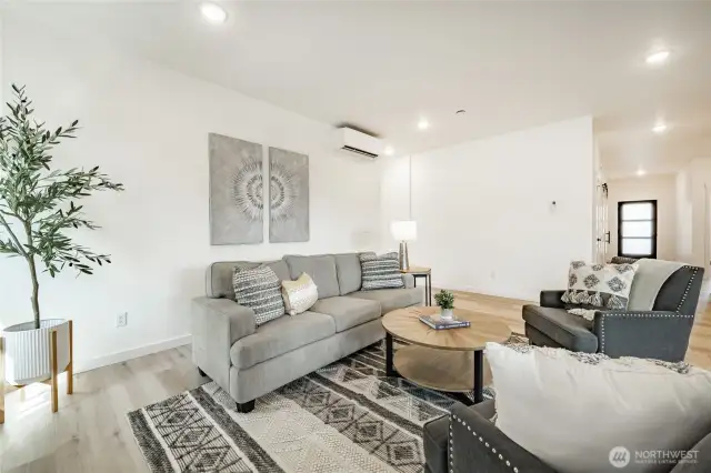 Primary entry at left corner. Photos shown are of a similar floor plan previously built in a different neighborhood (The Ridge in Blaine). Finishes and features may vary. Some items pictured reflect buyer-selected upgrades which are not included in the base price and may be added at an additional cost.