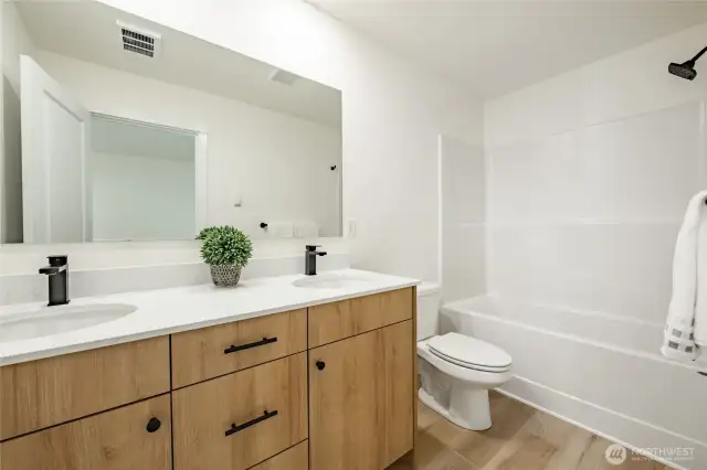 Photos shown are of a similar floor plan previously built in a different neighborhood (The Ridge in Blaine). Finishes and features may vary. Some items pictured reflect buyer-selected upgrades which are not included in the base price and may be added at an additional cost.