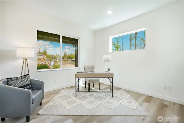 2nd Primary on main floor that could be used as a home office. Photos shown are of a similar floor plan previously built in a different neighborhood (The Ridge in Blaine). Finishes and features may vary. Some items pictured reflect buyer-selected upgrades which are not included in the base price and may be added at an additional cost.