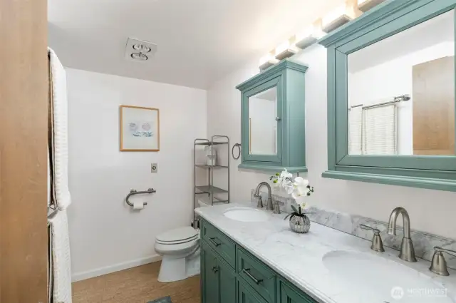 Refreshed 3/4 bath with cork flooring.