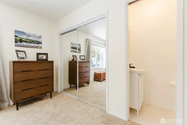 The primary bedroom features a half bath