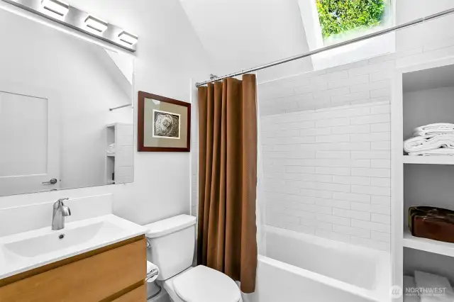 cottage upper bathroom with skylight
