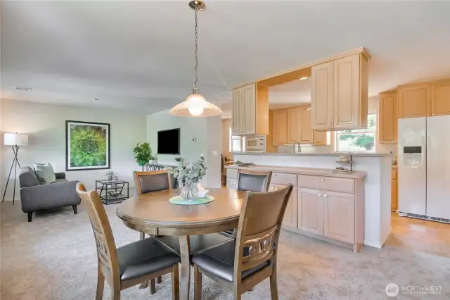 Bonus/family room with eating area and open to kitchen with custom cabinetry extension.