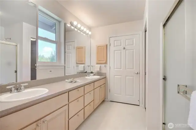 Primary bath with step-in shower and dual sinks. Enjoy the views too!