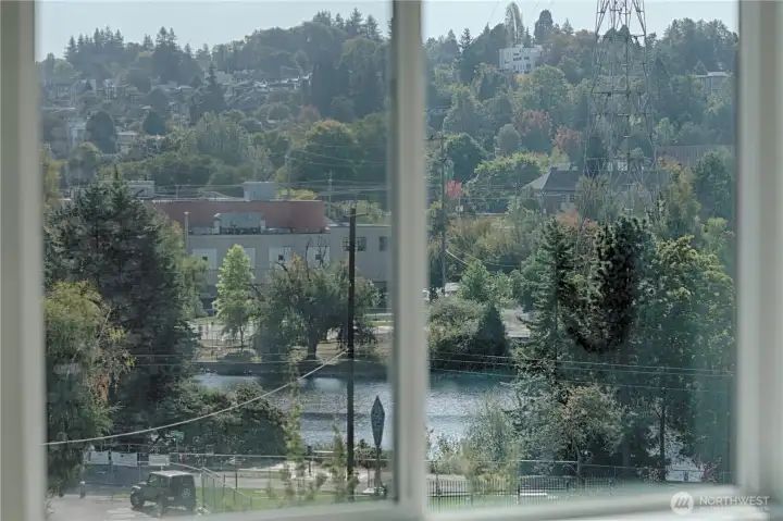 Canal and territorial views from primary bedroom. This view is also found in the living room and on the roof terrace.