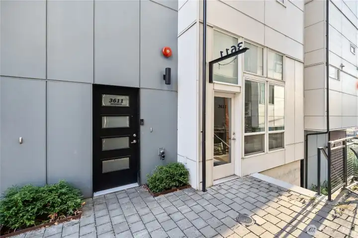 Separate entry for commercial space (plus adjoining interior door) with hanging sign that can be seen from both sides of the plaza