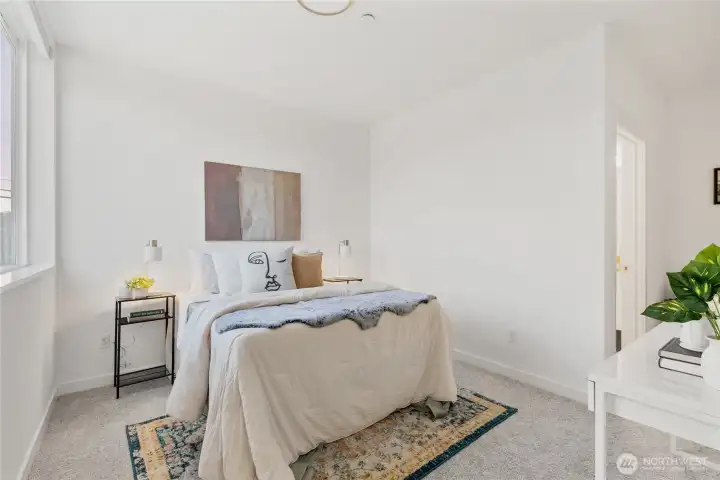 Secondary bedroom with  en suite bathroom. Each bedroom has heatpump cooling & heating