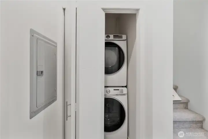 Hallway laundry  next to secondary bedroom