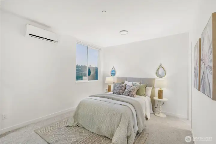 Primary bedroom with  en suite bathroom and walk-in closet. Views of Fremont canal from bedroom window. Each bedroom has heatpump cooling & heating