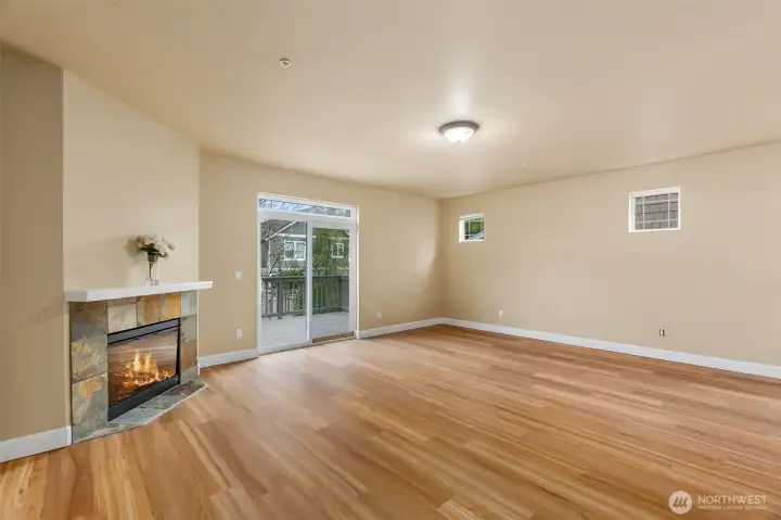 Pretty tile surround and mantel adds to the ambience of the great room.  Lovely new LPV flooring is a neutral color sure to go with any decor.  Easy to keep looking clean too!