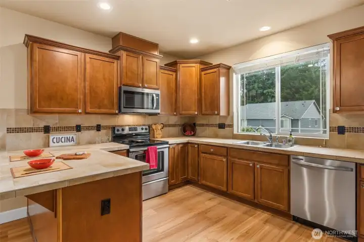 You will not run out of cupboard space in this kitchen.  Some of the cupboards have pullout shelving for ease of retrieving pots and pans.