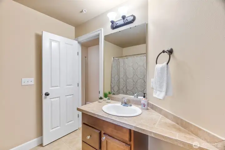 Upstairs "hallway" bathroom is a full bath.