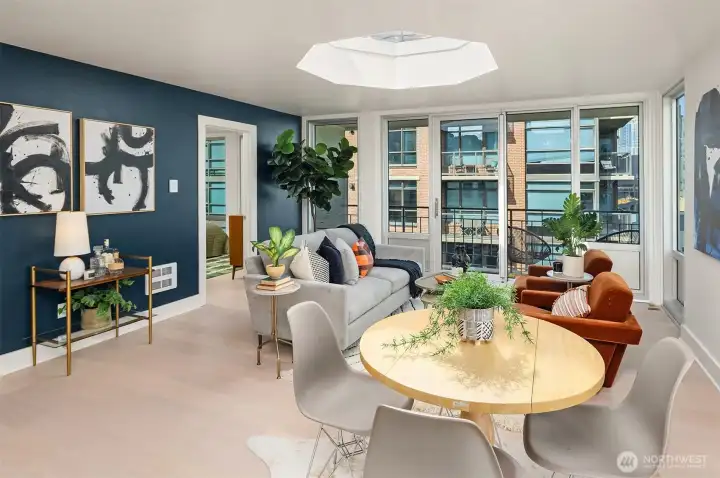 Living and dining area are filled with sunlight