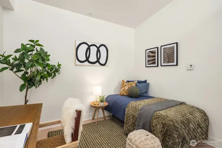 Second bedroom has high transom windows to let the light in