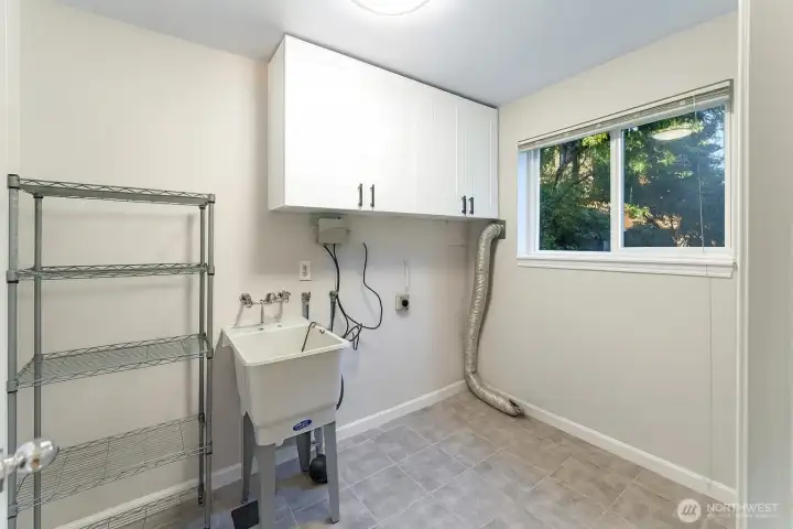 Laundry room with attached half bath