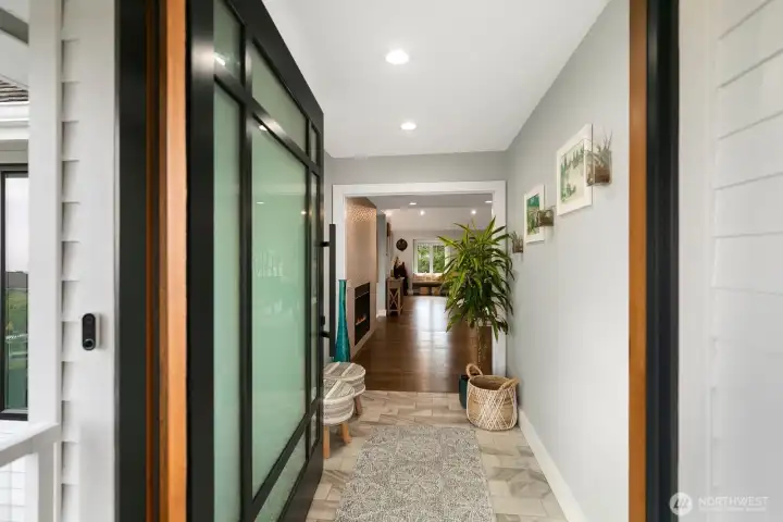 Formal entry with custom pivot door. $15,000.