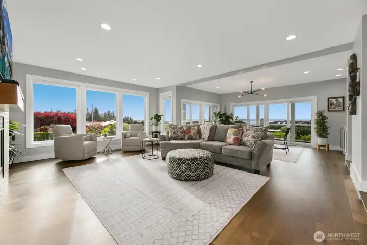 Glorious living room with 52" Montigo Phenom 2-sided see-through gas fireplace and views from every window allowing all year natural light.