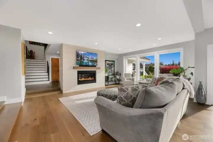 Living room. Solid wood floating mantel above fireplace.