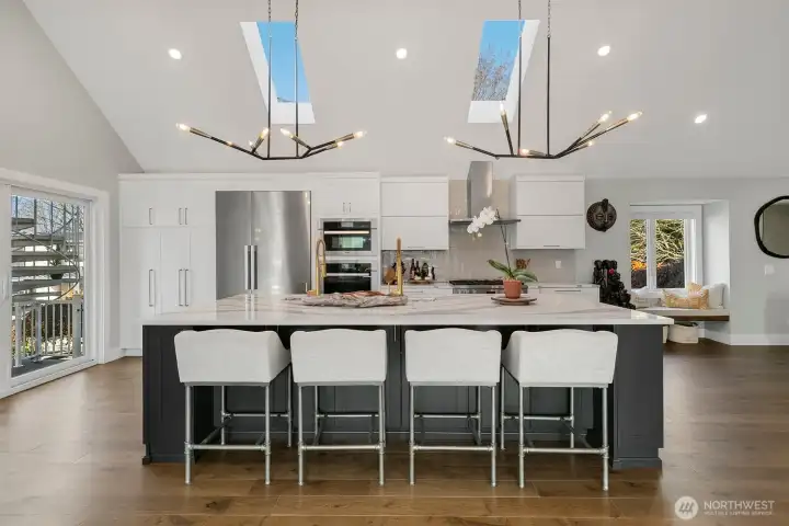 Custom Bellmont Cabinetry. Electronic touch-to-open overhead cabinets. Two large pantry cabinets with pullout drawers.