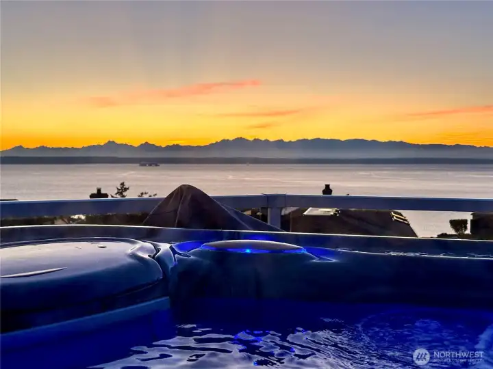 View roof top deck off of the primary bedroom with a hot tub.