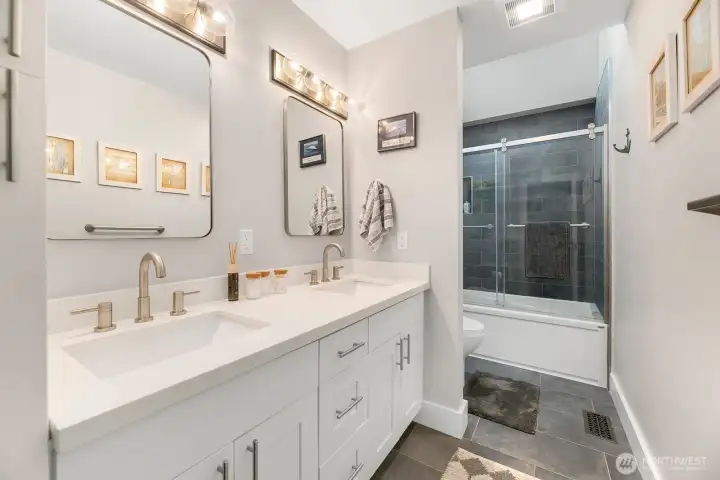 Almost never used full bathroom upstairs near the three bedrooms, separate from the upstairs primary suite. A large landing divides the areas.