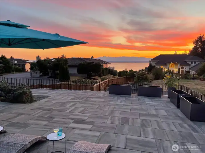 Outdoor Terraces: Raised the yard to be level and added a large tile terrace with cement walls to allow stellar water views & planted a bamboo wall to give more privacy.