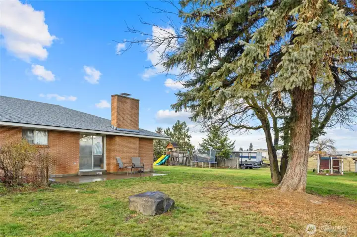 Side yard facing on the East side. You will get great morning sunshine. Plenty of room for a garden!