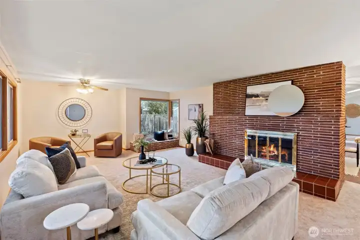 Plenty of space to entertain - enter to the inviting living room with cozy wood fireplace.