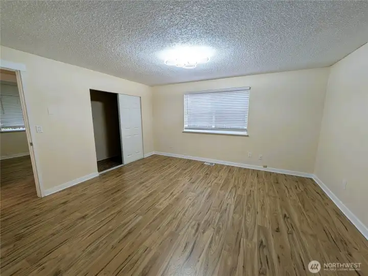 Primary bedroom with new LVP flooring. #11823 150th St Ct E, Puyallup, WA 98374