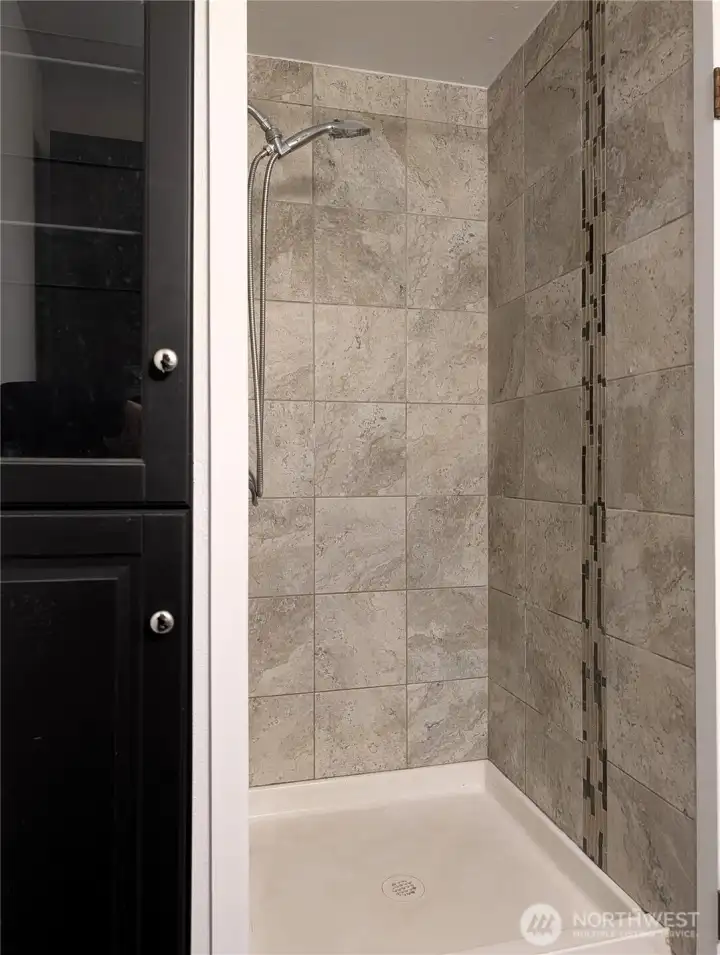 Primary bedroom with tile shower. #11823 150th St Ct E, Puyallup, WA 98374