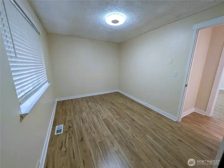 Bedroom 3 with new LVP flooring. #11823 150th St Ct E, Puyallup, WA 98374