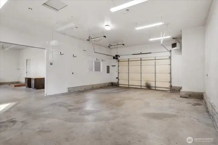 Shop/garage with room for 4 vehicles! Plus shop space to the left. Heated and power in place!