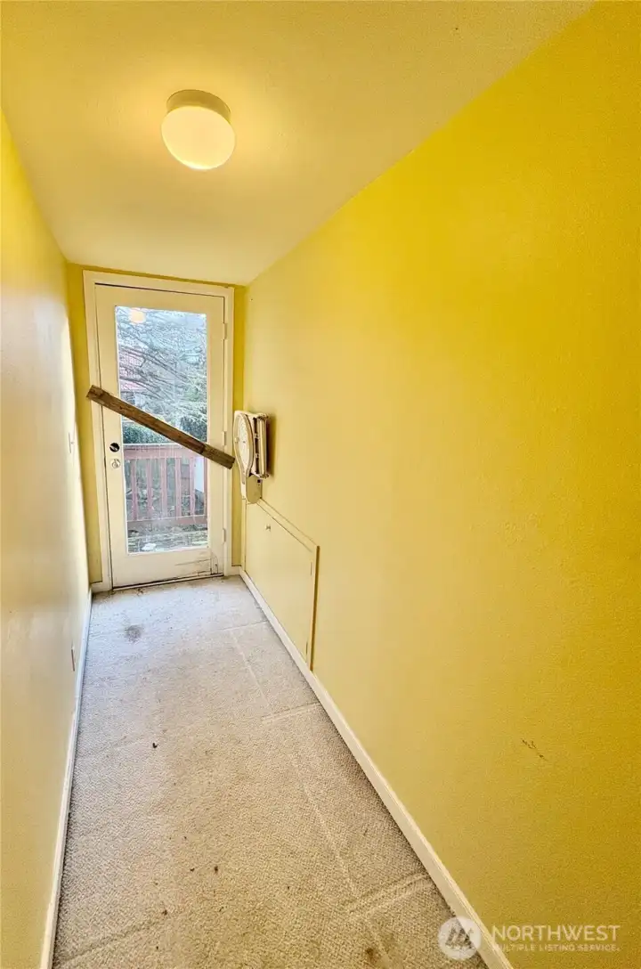 Upper hallway to sitting deck. (Railing is unsafe.)