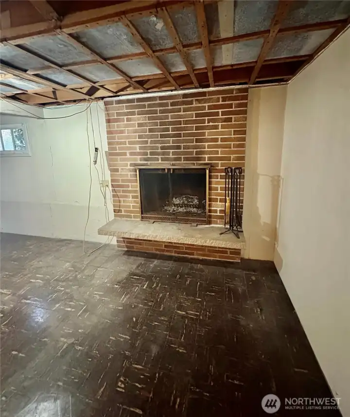 Wood burning fireplace on the lower level.