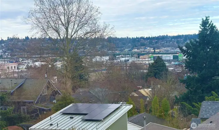 Looking SW from the primary bedroom; territorial view of the Ballard Bridge and Magnolia Hill.