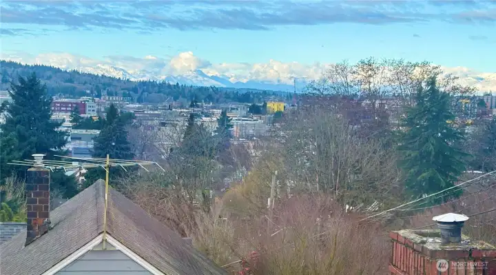 Blue sky over the cloudy Olympic Mountains.