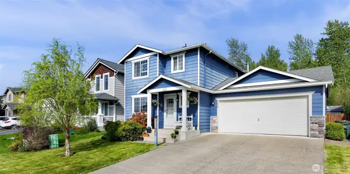Welcome to 7520 Clamdigger Lane, plenty of parking and a sweeet covered front porch.