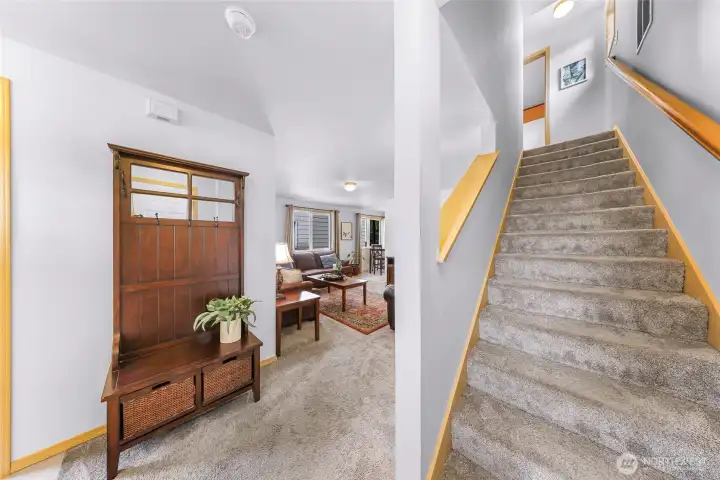 Stairs to the upper level.  Door to the garage is to the right at the bottom of the stairs