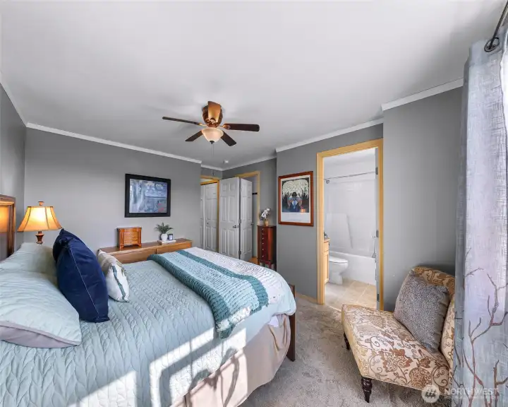 Ceiling fan, ensuite bathroom and walk in closet to the right of the door