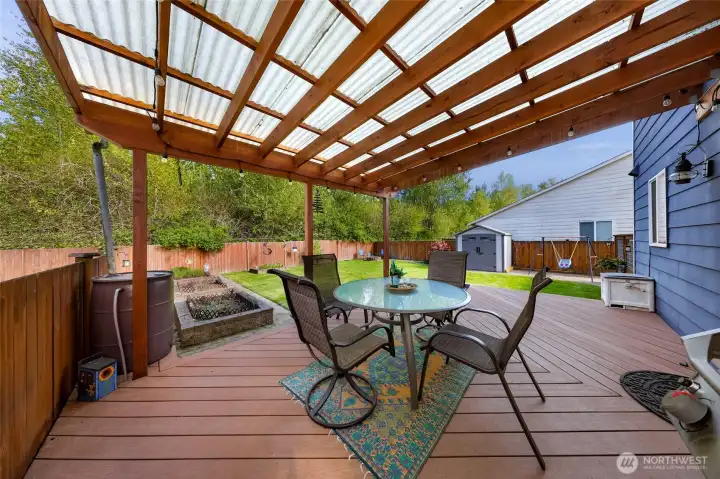 The covered patio is a perfect spot to enjoy your morning coffee and listen to the birds chirp.