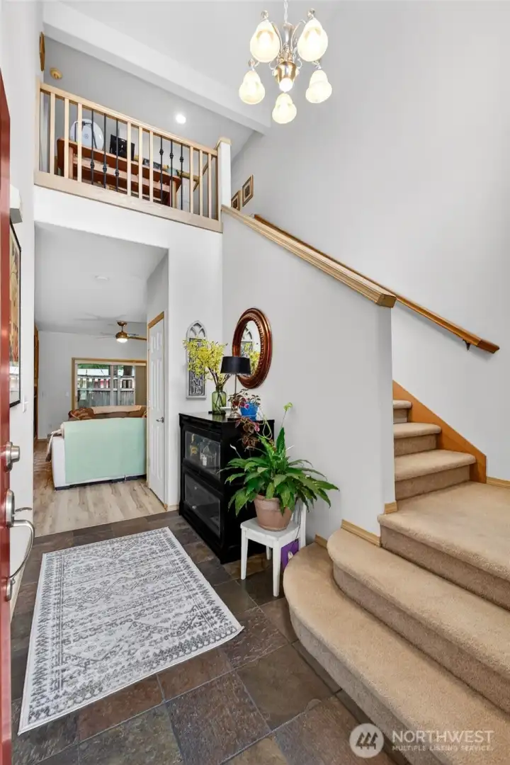 The vaulted ceilings and well-lit entry beckons you in to your spacious townhome.