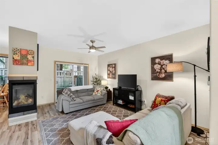 Enjoy a 3-sided gas fireplace or bask in the cool air of the heat pump provided AC.