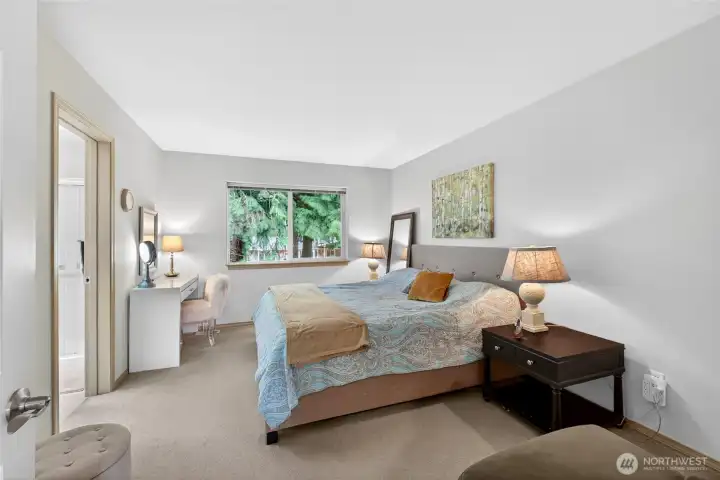 The primary bedroom has plenty of space, even for a king size bed.
