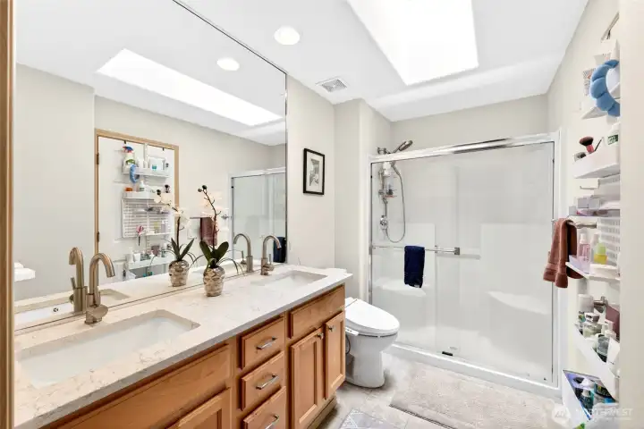 The updated bathroom features quartz counters, new fixtures and yes ELFA modules in the closet.
