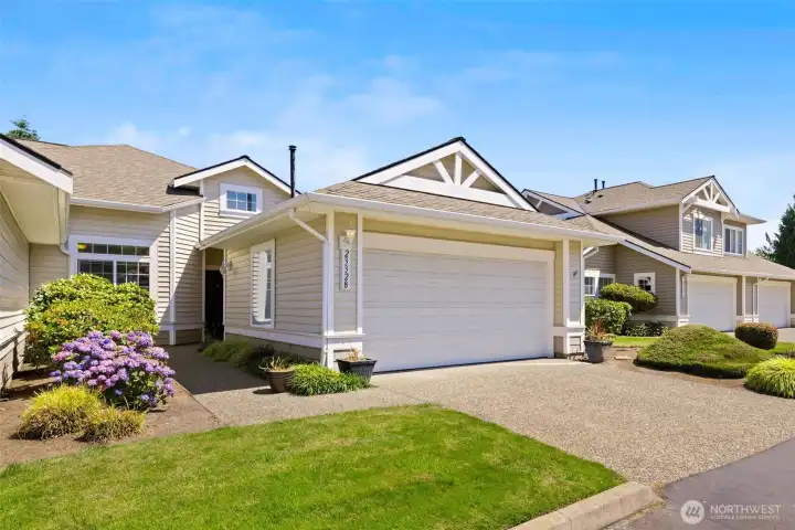 Two car garage end unit with extra driveway parking