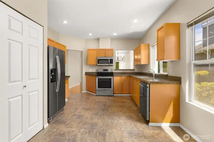 Spacious kitchen area with great counter top space and storage space